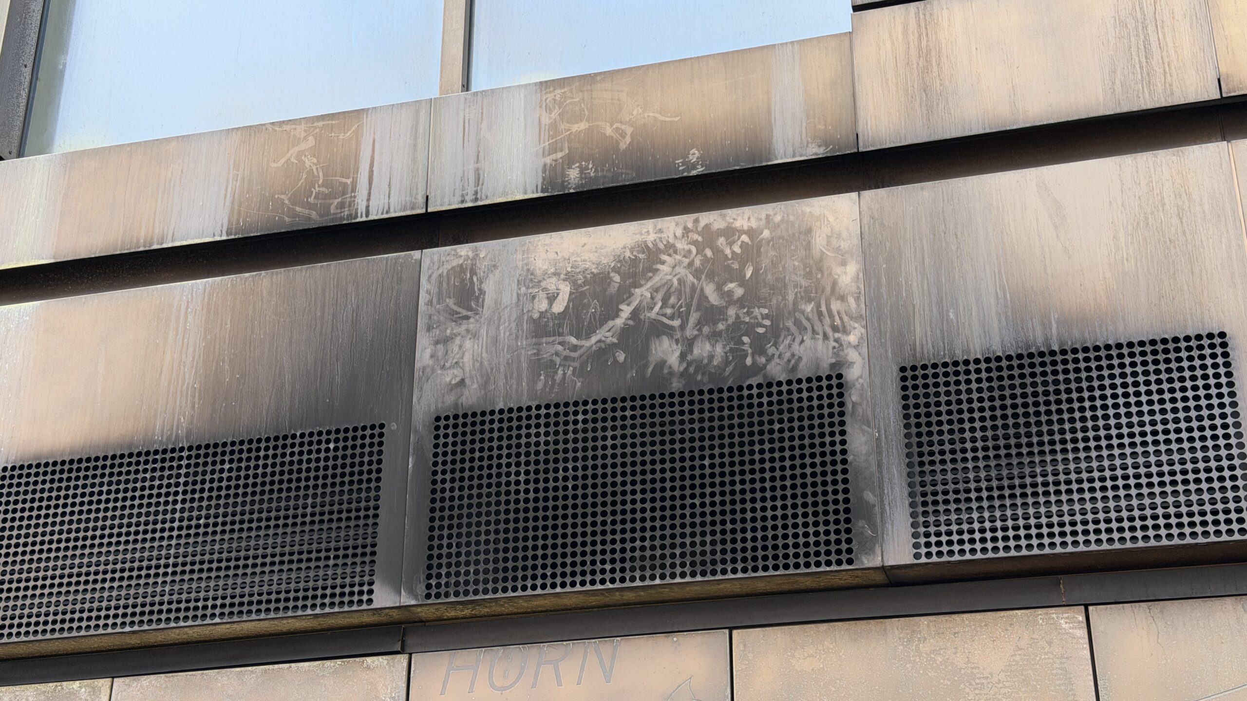 Smoke residue staining on commercial building surface