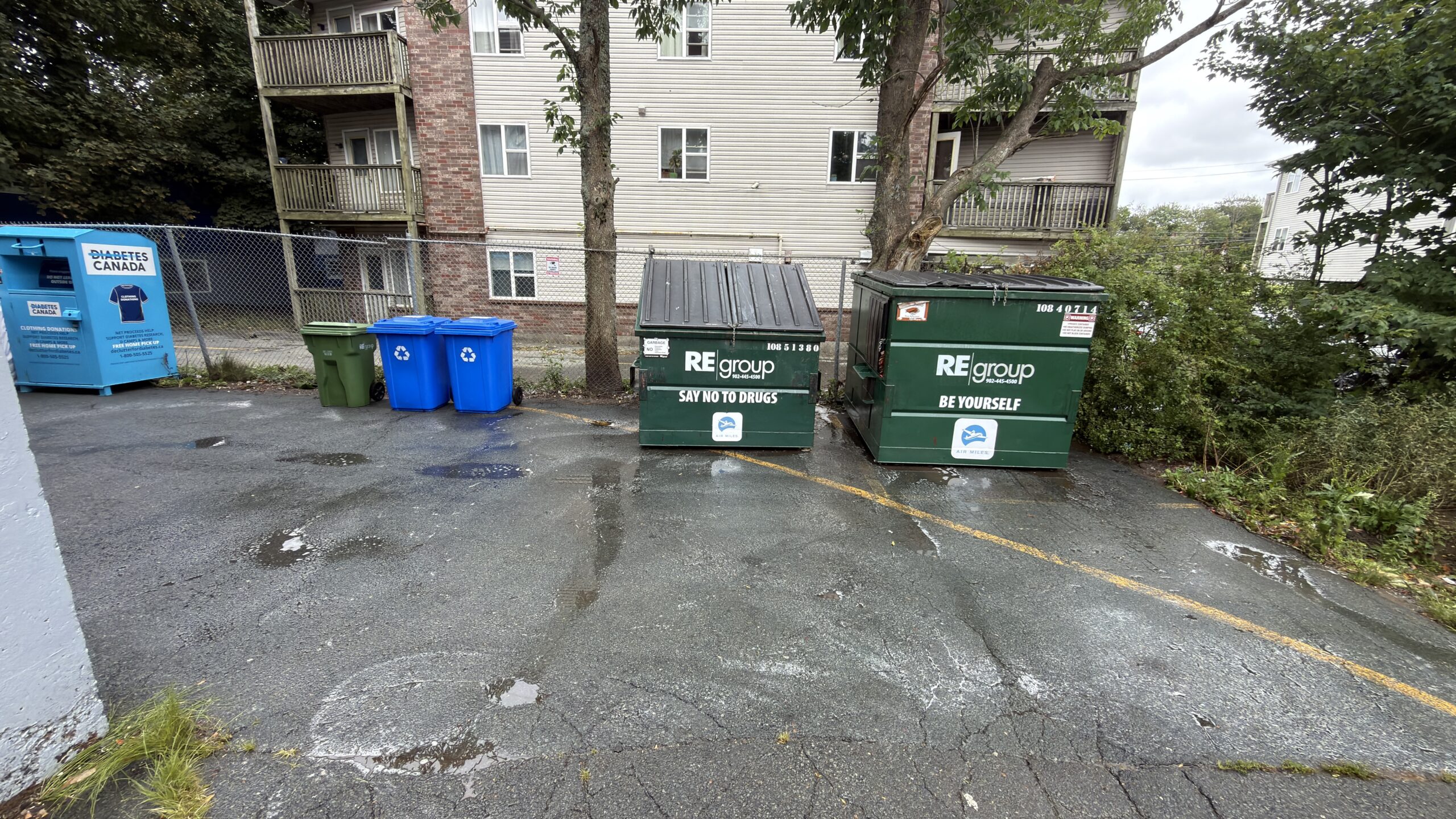 Outdoor garbage and recycling area after cleaning