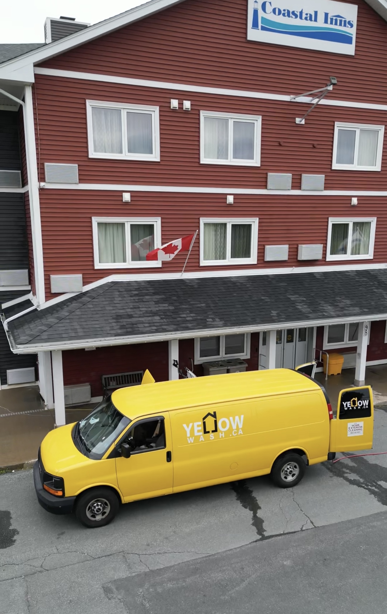 Yellow Wash service van outside the Coastal Inns hotel entrance